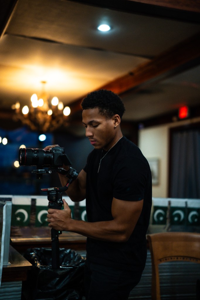 Elijah Porter on set with a camera